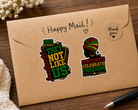 Two Juneteenth-themed stickers on a brown envelope with 'Happy Mail!' text.