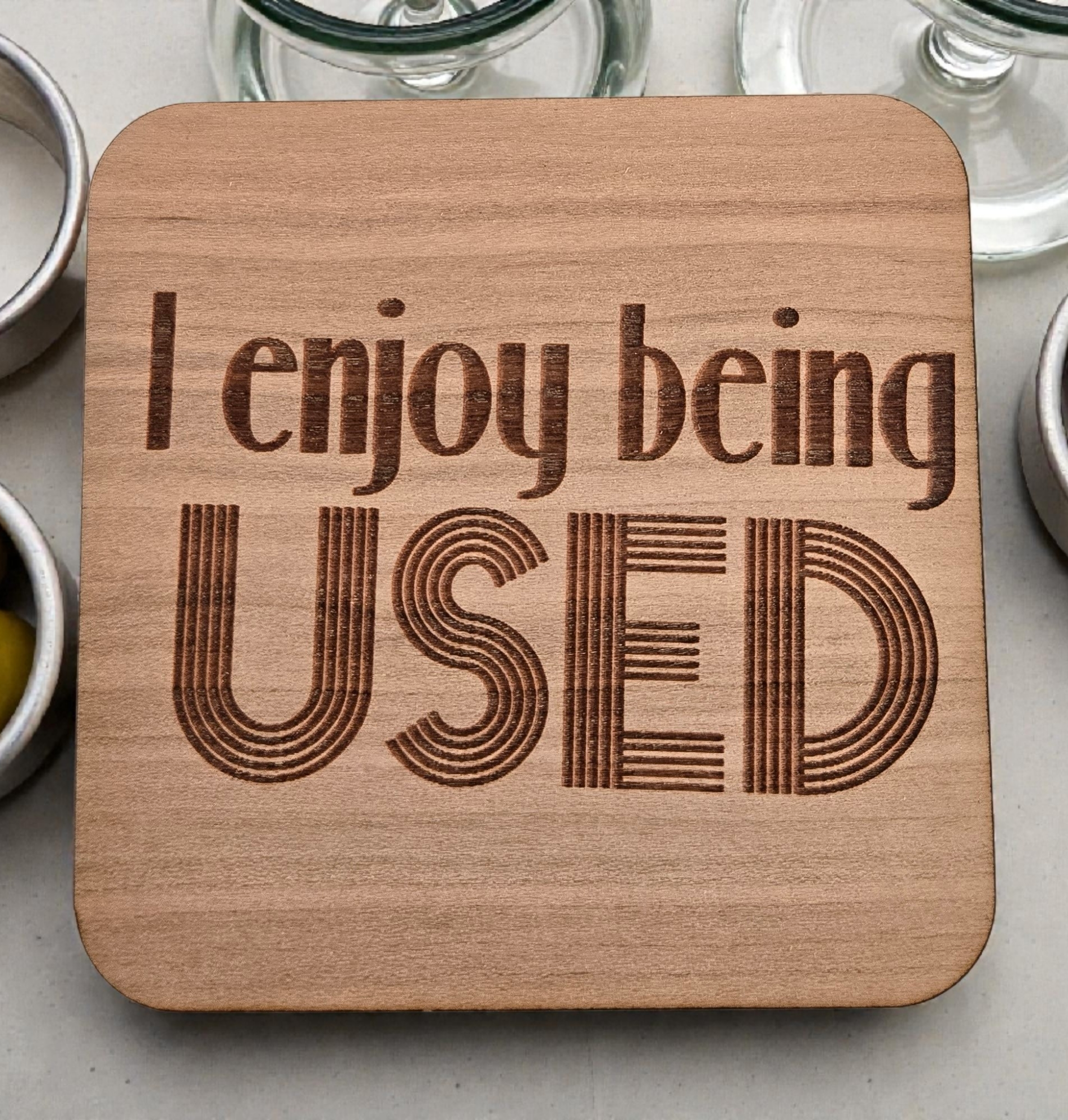 Wooden coaster with 'I enjoy being USED' 
