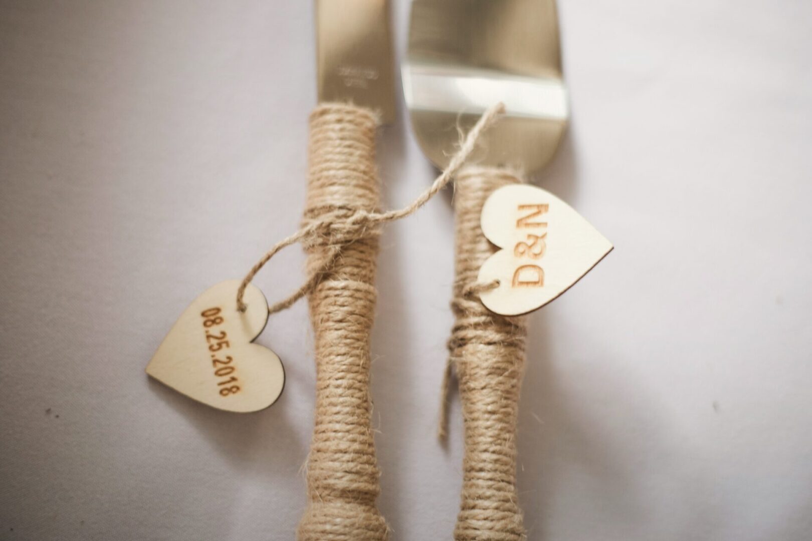 A couple of forks and spoons with twine wrapped around them.