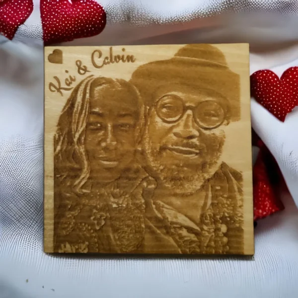 A wooden plaque with a picture of a man and woman.