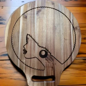 A wooden board with a picture of a woman on it.