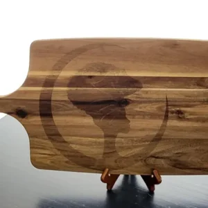 A wooden cutting board with an image of the silhouette of a person.